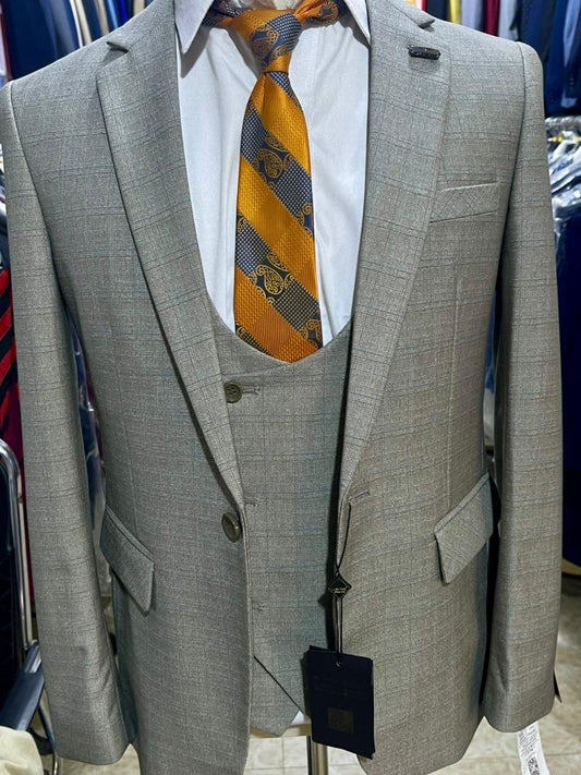 Grey check three-piece suit features a slim-fit cut